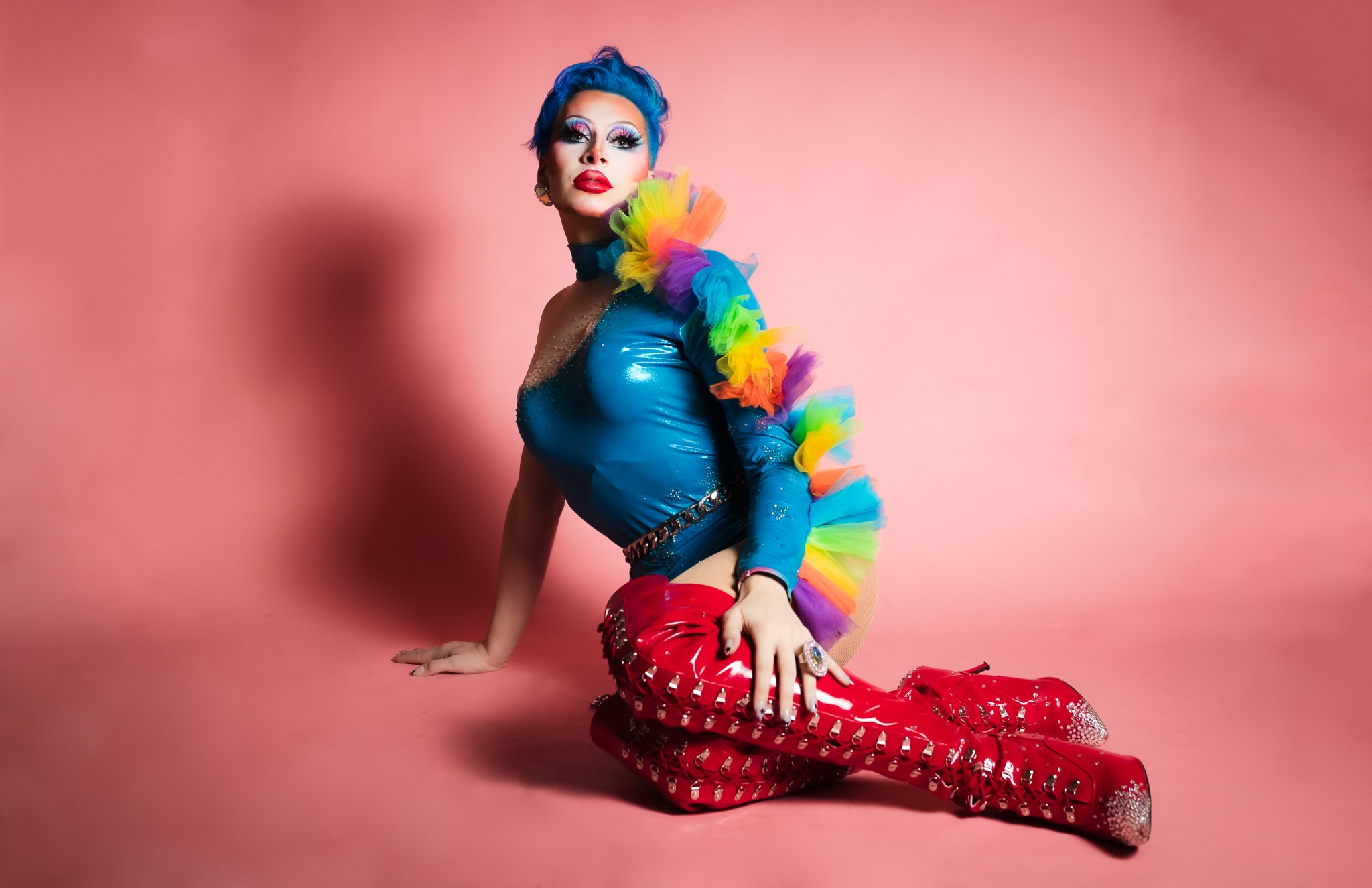 Blonde Vanity in a blue and pink editorial portrait